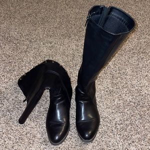 Black and gold zip up wide calf boots.